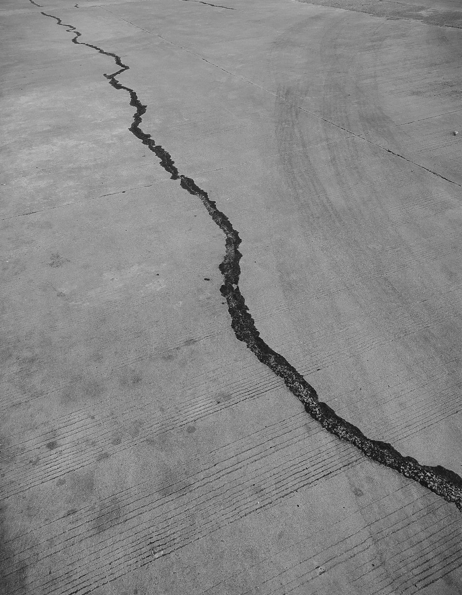 grayscale photo of a wooden floor